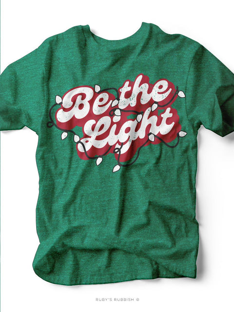 Be the Light | Holiday Edition T-Shirt | Ruby’s Rubbish® - Ruby's Rubbish Wholesale