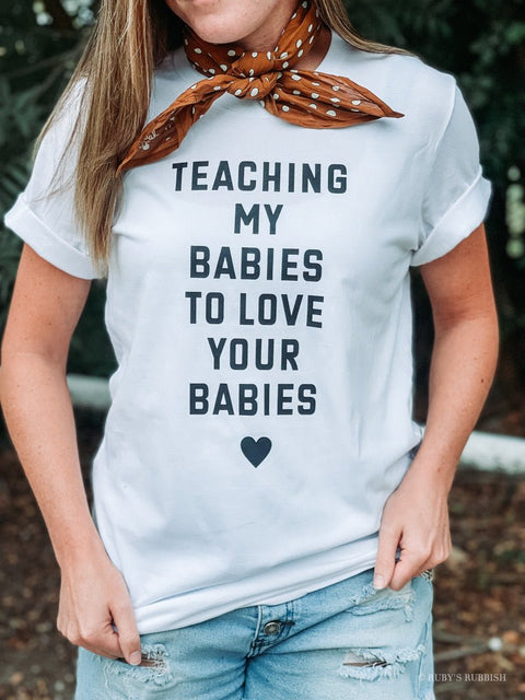 Teaching My Babies to Love Your Babies | T-Shirt | Ruby’s Rubbish® - Ruby's Rubbish Wholesale